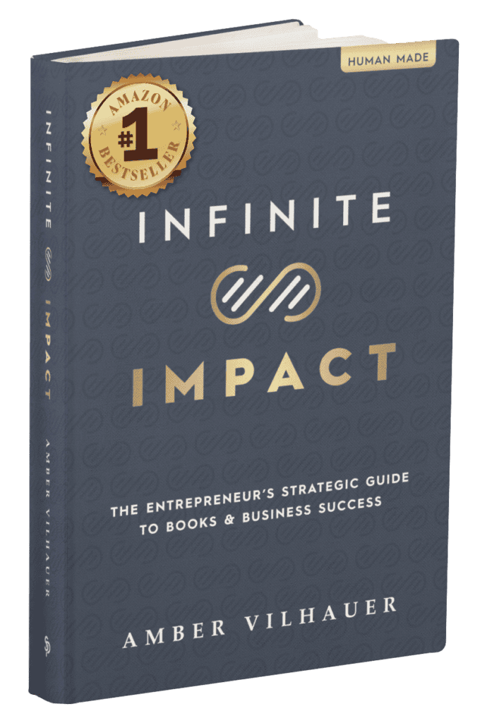 A book titled “Infinite Impact: The Entrepreneur’s Strategic Guide to Books & Business Success” by Amber Vilhauer, featuring an Amazon #1 Bestseller badge on the cover.